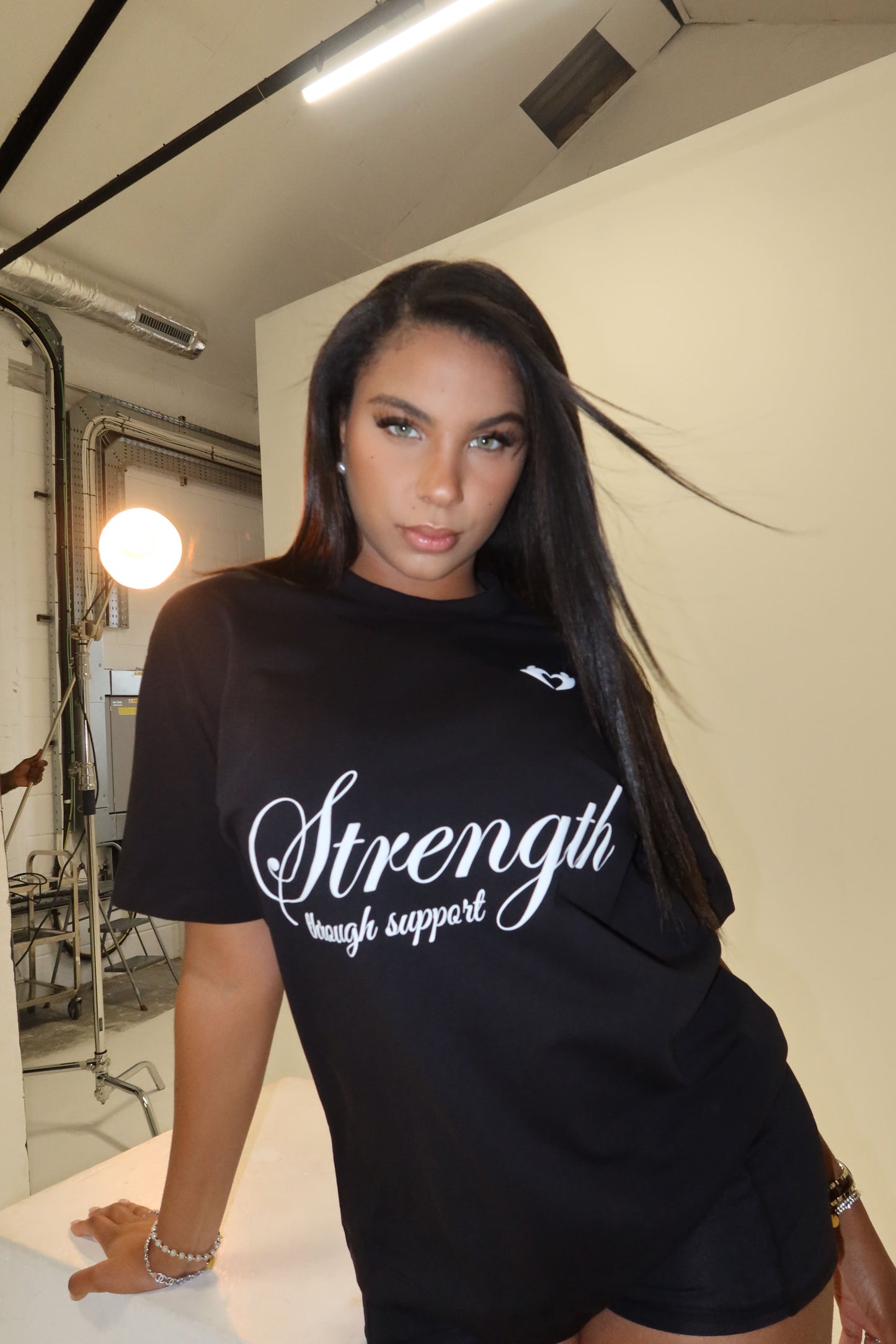 Strength Through Support” T-Shirt – We Hold A Hand Edition
