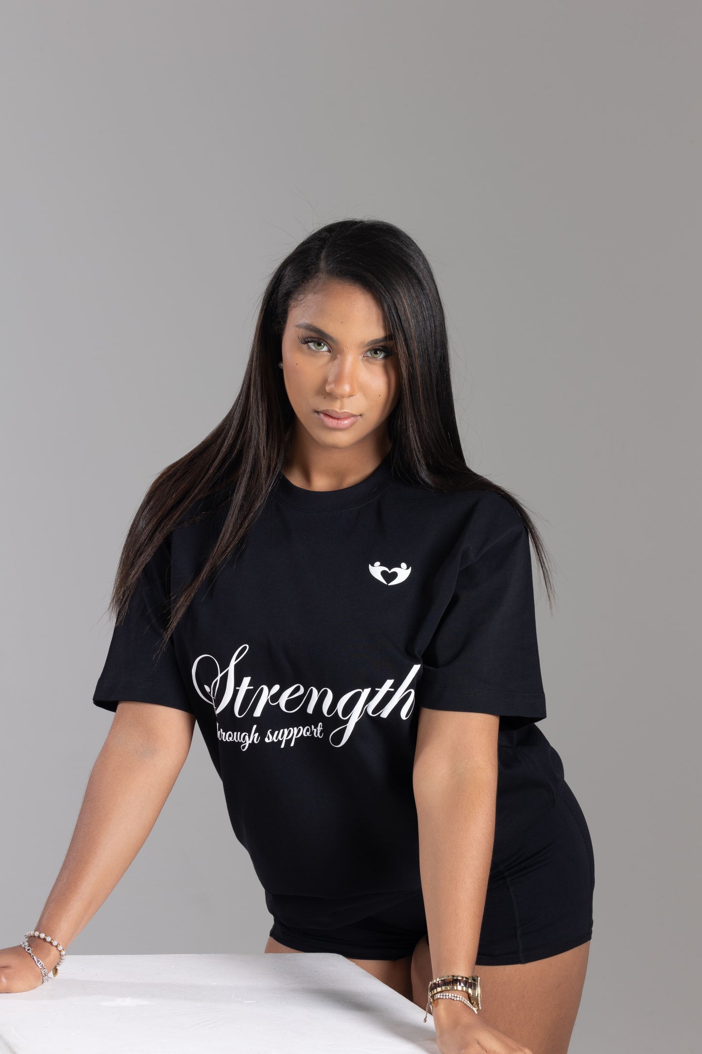 Strength Through Support” T-Shirt – We Hold A Hand Edition
